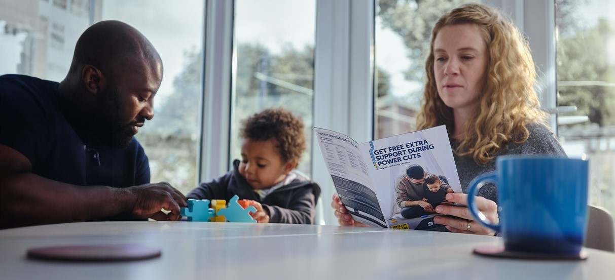 Young family reading PSR leaflet