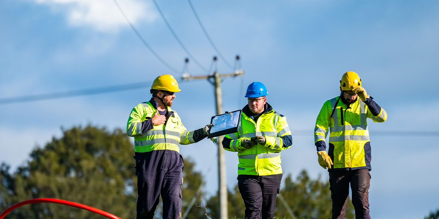 3-engineers-walking-in-field-1400x700.jpg