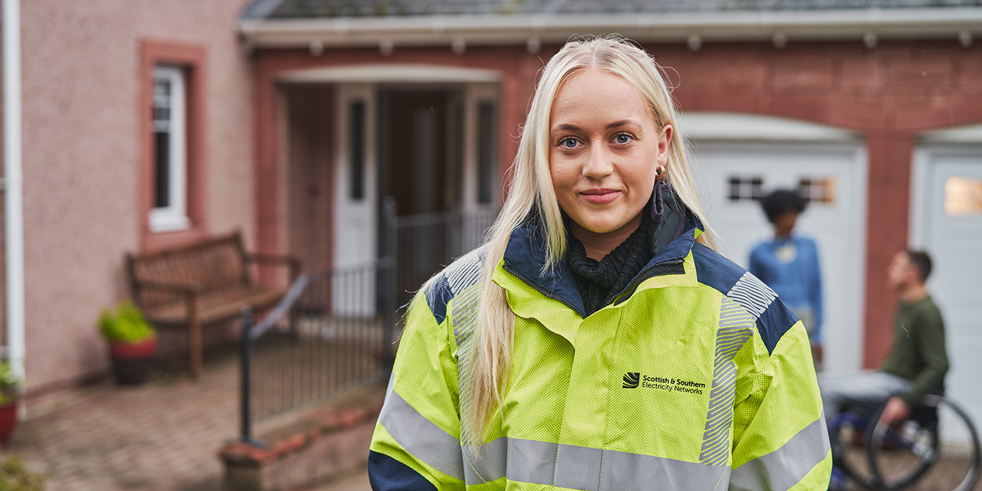 Engineer smiling at camera in street