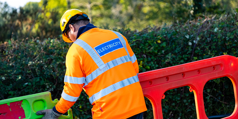 Image of engineer placing barriers in residential street